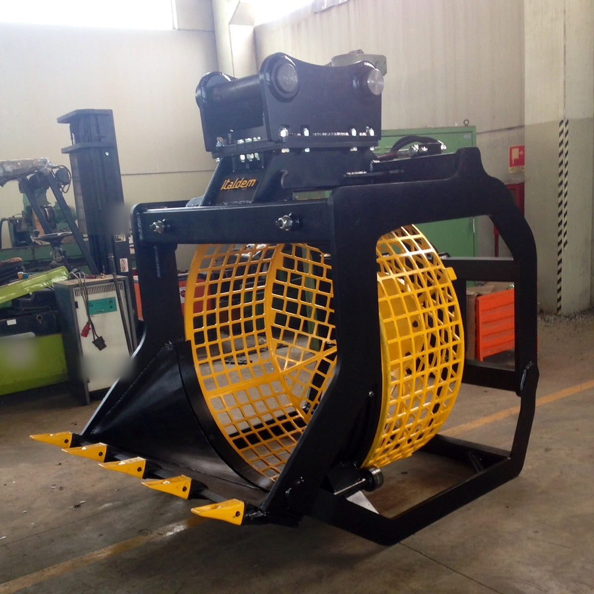 Italdem GV screening bucket with yellow rotating drum in the workshop, three-quarter view