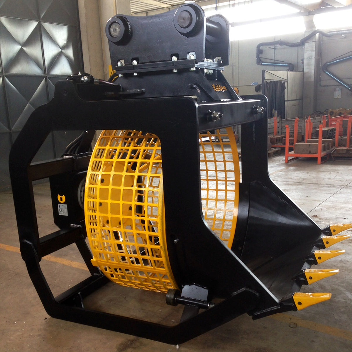Rear three-quarter view of an Italdem GV screening bucket with yellow drum in the factory